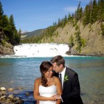 Banff Wedding Photographer | The Rimrock Hotel | Bride and groom in front of a waterfall