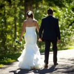 Banff Wedding Photographer | The Rimrock Hotel | Bride and groom walking holding hands