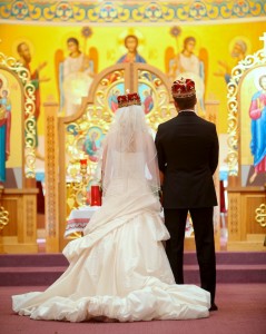 Calgary Wedding Photographer | Edmonton Vegreville wedding | Holy trinity Ukrainian catholic church bride and groom at alter with crowns