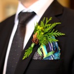 Calgary Wedding Photographer | Edmonton Vegreville wedding | grooms boutonniere natural with pinecone green berries and fern