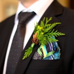 Calgary Wedding Photographer | Edmonton Vegreville wedding | grooms boutonniere natural with pinecone green berries and fern