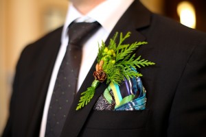 Calgary Wedding Photographer | Edmonton Vegreville wedding | grooms boutonniere natural with pinecone green berries and fern