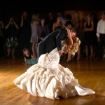 Calgary Wedding Photographer | Edmonton Vegreville wedding | Groom dips bride on the dance floor, first dance
