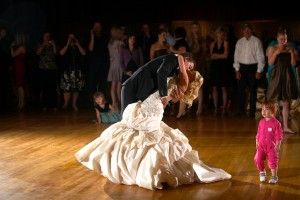 Calgary Wedding Photographer | Edmonton Vegreville wedding | Groom dips bride on the dance floor, first dance