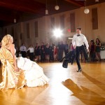 Calgary Wedding Photographer | Edmonton Vegreville wedding | Garter groom dancing for bride sitting in chair