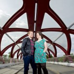 Calgary Wedding photographer | Christine & Peter Engagement session | E-session couple holing each other on peace bridge