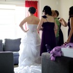 Christine & Peter Valley Ridge Golf Course wedding | Calgary Wedding Photography | Bride getting dress laced up