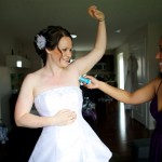 Christine & Peter Valley Ridge Golf Course wedding | Calgary Wedding Photography | Bride getting deodorant applied by friend