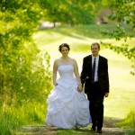 Christine & Peter Valley Ridge Golf Course wedding | Calgary Wedding Photography | Bride and groom walking up hill through tunnel of trees