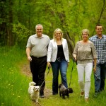 Lamb family | Calgary family photography | walking down a dirt path with dogs