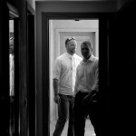 Destination wedding photographer | barcelo maya tropical resort Mexico | wedding photos | Groom entering room black and white