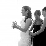 Destination wedding photographer | barcelo maya tropical resort Mexico | wedding photos | excited bride getting dress tied up