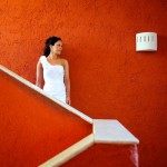 Destination wedding photographer | barcelo maya tropical resort Mexico | wedding photos | bride in front of red wall