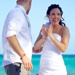 Destination wedding photographer | barcelo maya tropical resort Mexico | wedding photos | Happy bride claps after saying "I Do"