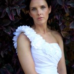 Destination wedding photographer | barcelo maya tropical resort Mexico | wedding photos | Bride bridal portrait in front of wall of purple leaves