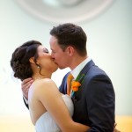 Calgary wedding photographer | Holy spirit catholic church wedding | bride and groom first kiss