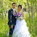 Calgary wedding photographer | Fish Creek Park wedding photos | Bride and groom holding flowers in birch trees