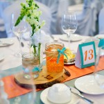 Calgary wedding photographer | Spruce Meadows wedding photos | Orange and teal centre pieces